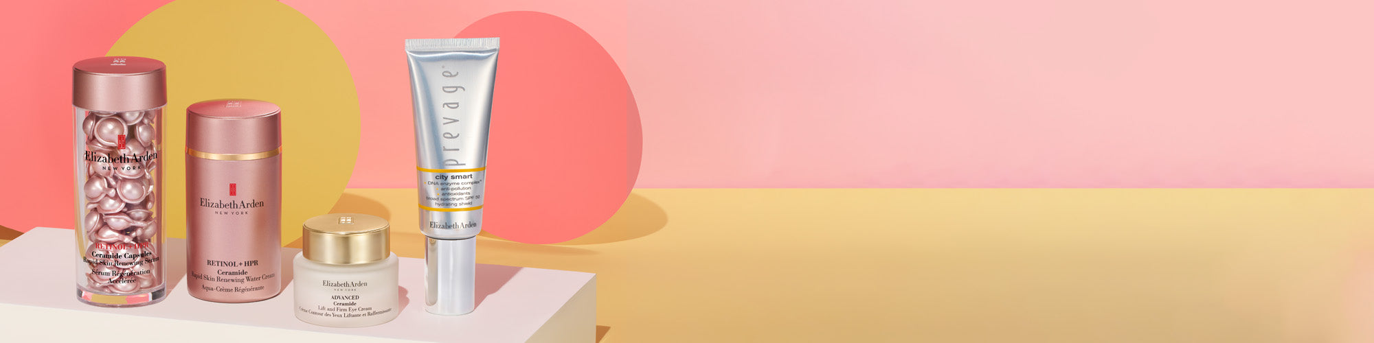 skincare products on pink background
