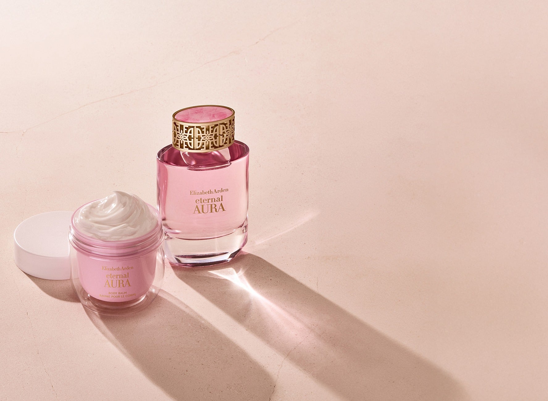  Elizabeth Arden Eternal Aura Eau de Parfum bottle in pink glass with gold cap