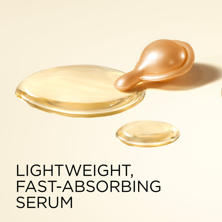 A close-up studio shot of translucent golden serum droplets on a warm cream background, with the text 'LIGHTWEIGHT, FAST-ABSORBING SERUM' below.
