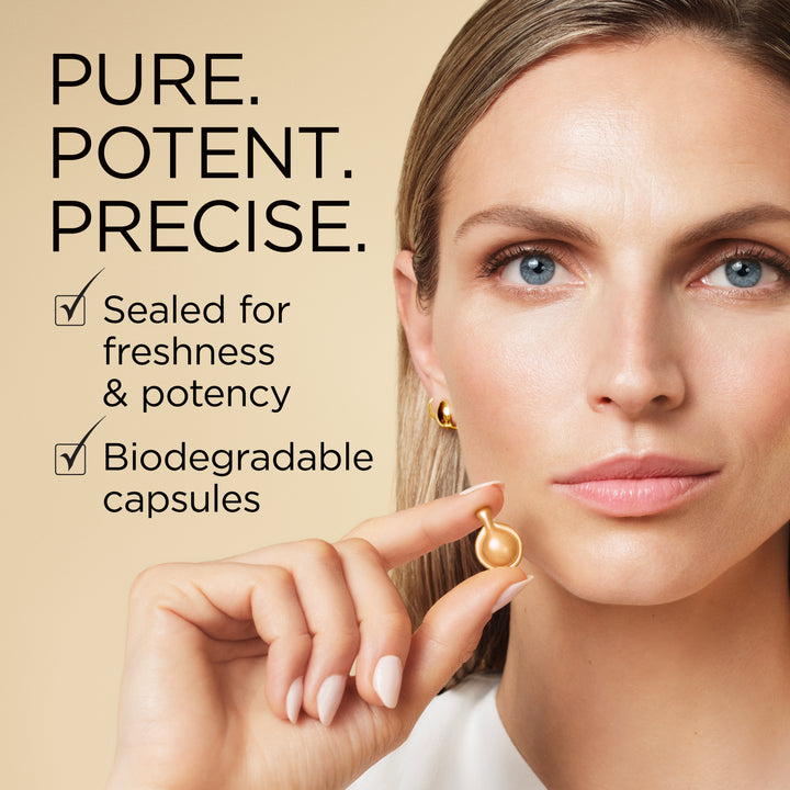 A close-up of a woman holding a small gold capsule between her fingers, with text on the left reading 'PURE. POTENT.