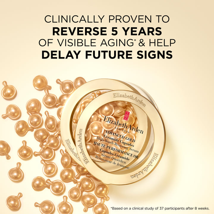 Elizabeth Arden Powerbomb Reverse Visible Aging Complex™ capsules arranged around a clear circular container on a warm cream background, with large promotional text above and a small footnote at bottom right.