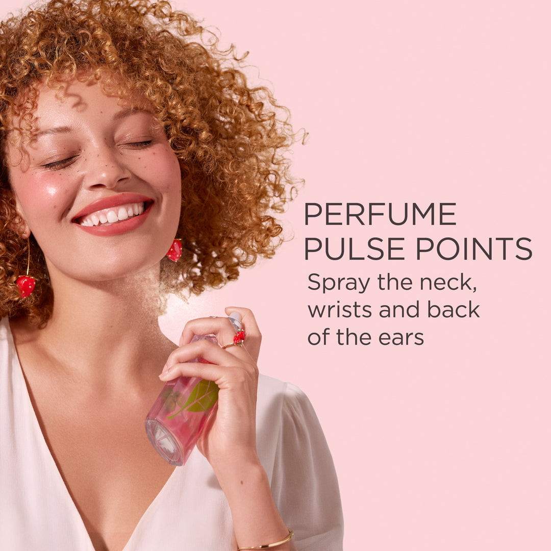 Woman spraying Green Tea Strawberry Basil Eau De Toilette on neck pulse point