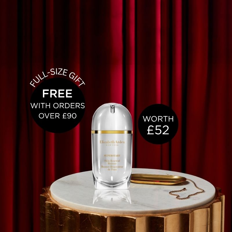Elizabeth Arden Superstart Skin Renewal Booster placed on top of a circular marble top with a small gold long plate next to it and emphasized against a deep red curtain background. 