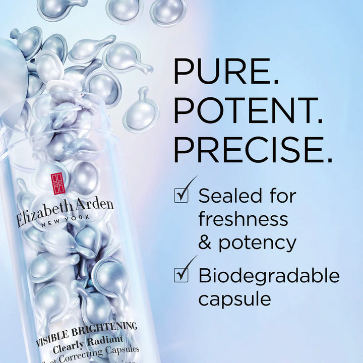 Elizabeth Arden Visible Brightening Correcting Capsules bottle shown on a light blue background with floating silver capsules and text reading 'PURE. POTENT.