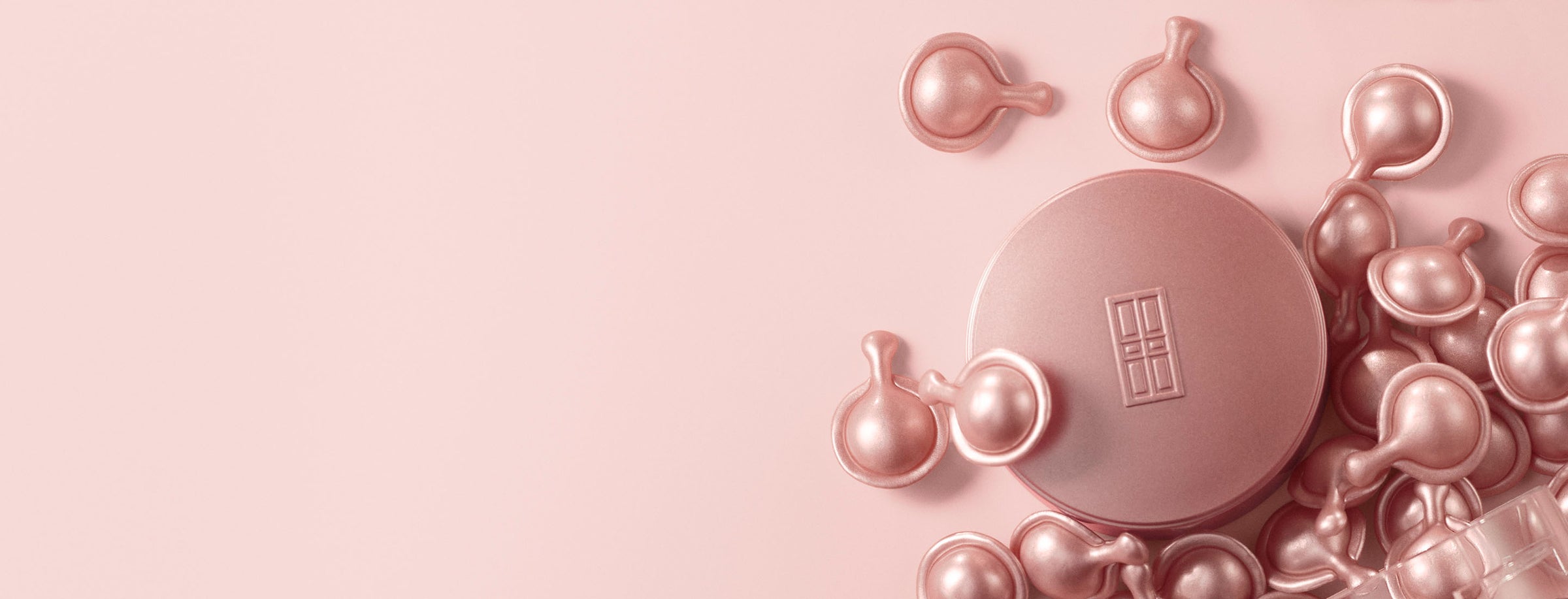 Retinol + HPR Ceramide Capsule Serum Cap and loose capsules on pink background. Desktop Version