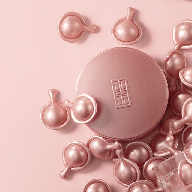 Retinol + HPR Ceramide Capsule Serum Cap and loose capsules on pink background. Mobile Version